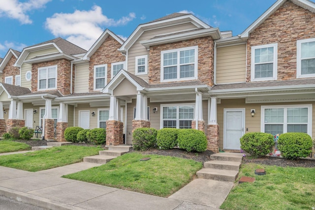 127 Cobblestone Place Dr, Goodlettsville, TN 37072 - view of front of home featuring stone siding and a front lawn