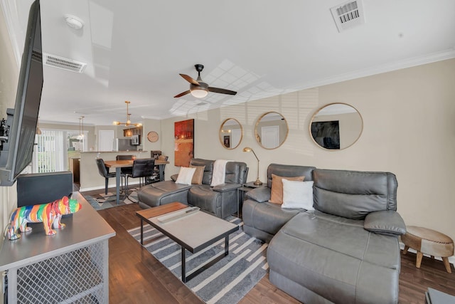 127 Cobblestone Place Dr, Goodlettsville, TN 37072 - living room featuring ceiling fan, crown molding, dark wood finished floors, a chandelier, and baseboards