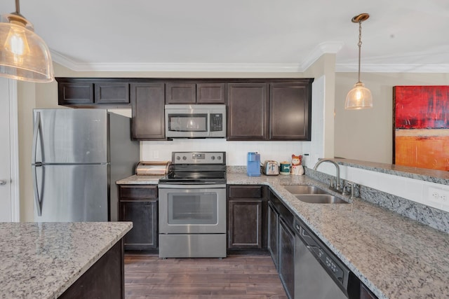 127 Cobblestone Place Dr, Goodlettsville, TN 37072 - kitchen featuring stainless steel appliances, a sink, crown molding, dark brown cabinetry, and dark wood finished floors