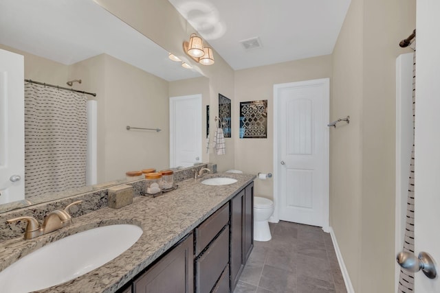 127 Cobblestone Place Dr, Goodlettsville, TN 37072 - full bathroom with toilet, baseboards, double vanity, and curtained shower