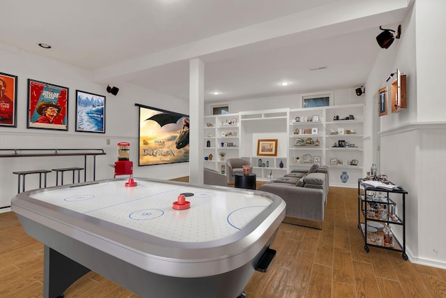 805 Walden Dr, Franklin, TN 37064 - recreation room featuring wood finished floors, built in shelves, and beamed ceiling