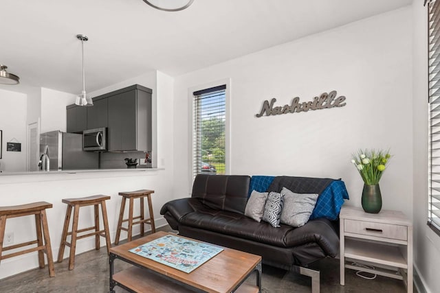 living room featuring concrete floors