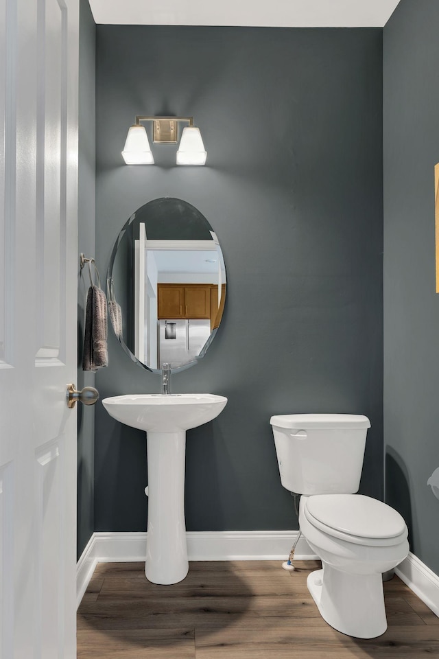 118 Buckfast Ln, Antioch, TN 37013 - bathroom featuring baseboards, toilet, and wood finished floors