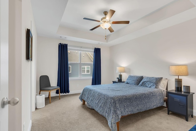 118 Buckfast Ln, Antioch, TN 37013 - bedroom featuring light carpet, baseboards, a raised ceiling, and ceiling fan
