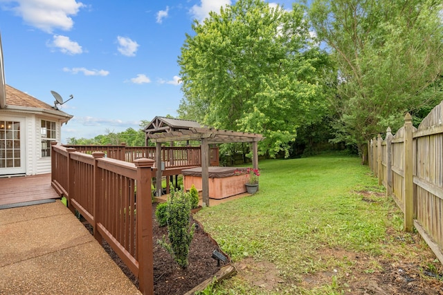 view of yard featuring a hot tub, a wooden deck, and a pergola