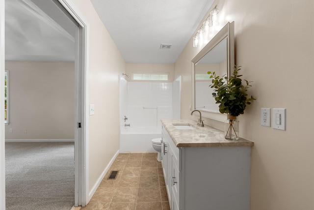 full bathroom featuring vanity, toilet,  shower combination, tile patterned flooring, and baseboards