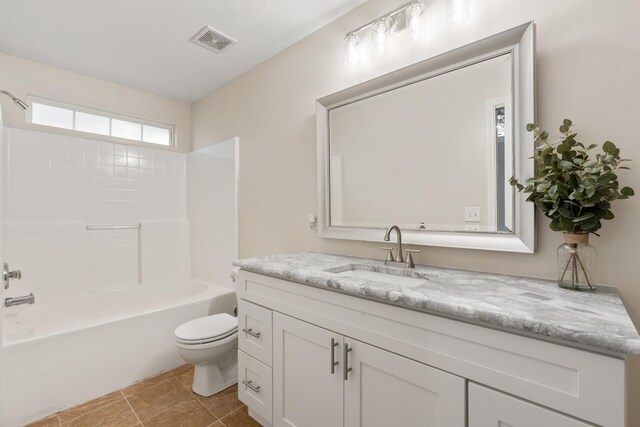 full bathroom featuring toilet, vanity, shower / washtub combination, and tile patterned flooring