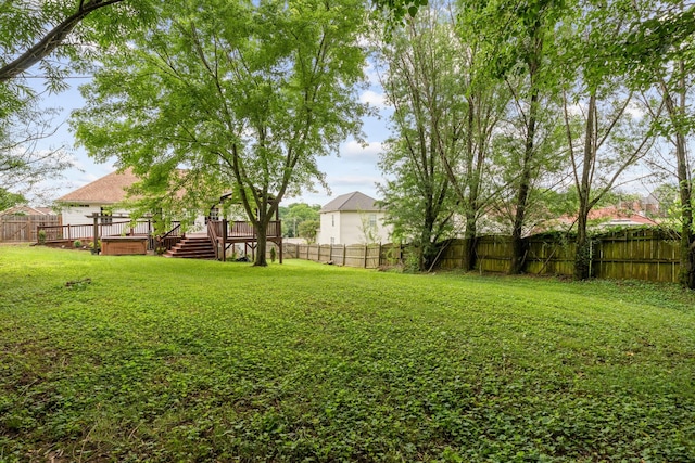 view of yard featuring a wooden deck