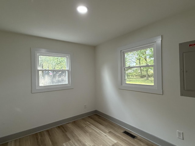 305 Twelve Oaks Rd, Tullahoma, TN 37388 - spare room featuring electric panel, baseboards, and light wood-style floors