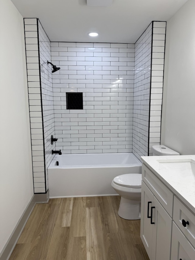 305 Twelve Oaks Rd, Tullahoma, TN 37388 - bathroom with toilet, wood finished floors, vanity, and  shower combination