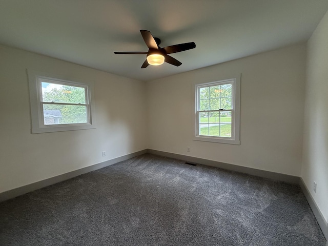 305 Twelve Oaks Rd, Tullahoma, TN 37388 - unfurnished room featuring dark carpet, a ceiling fan, and baseboards