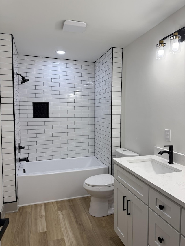 305 Twelve Oaks Rd, Tullahoma, TN 37388 - full bathroom with toilet, vanity, wood finished floors, bathtub / shower combination, and recessed lighting