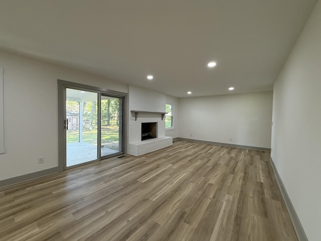 305 Twelve Oaks Rd, Tullahoma, TN 37388 - unfurnished living room with recessed lighting, wood finished floors, baseboards, and a fireplace