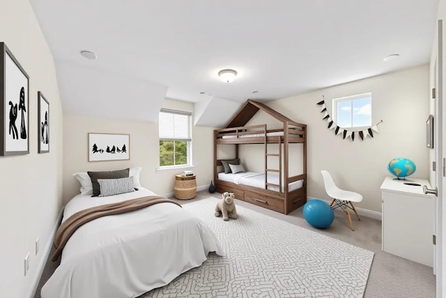 bedroom with carpet, vaulted ceiling, and baseboards