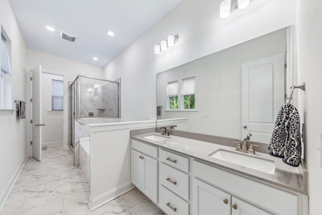 full bathroom with marble finish flooring, a shower stall, double vanity, baseboards, and recessed lighting