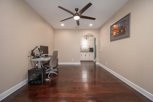 office area with ceiling fan, arched walkways, dark wood finished floors, recessed lighting, and baseboards