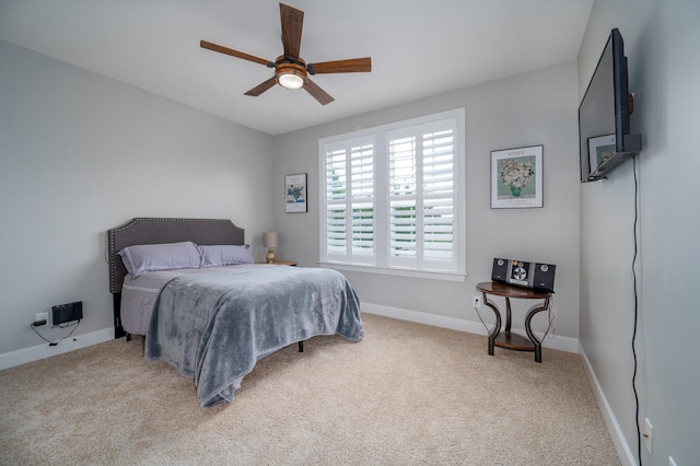 bedroom featuring carpet floors, baseboards, and ceiling fan