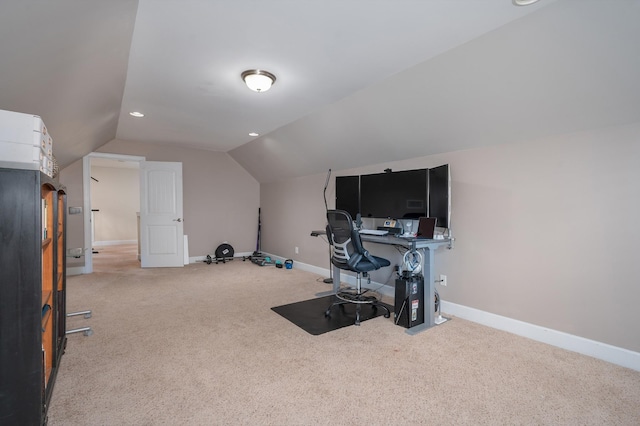 office area with carpet, vaulted ceiling, and baseboards