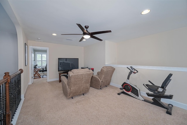 workout room featuring carpet flooring, ceiling fan, recessed lighting, arched walkways, and baseboards