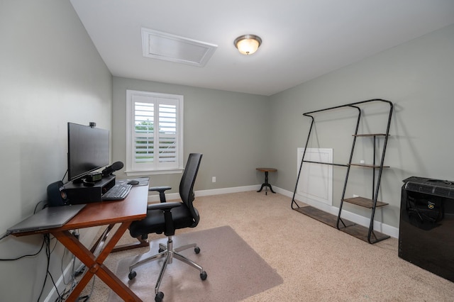 carpeted office space with baseboards