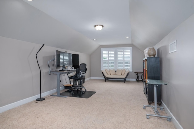 home office with carpet, vaulted ceiling, and baseboards