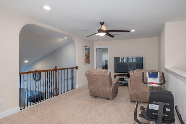 living room with a ceiling fan, recessed lighting, light colored carpet, and baseboards