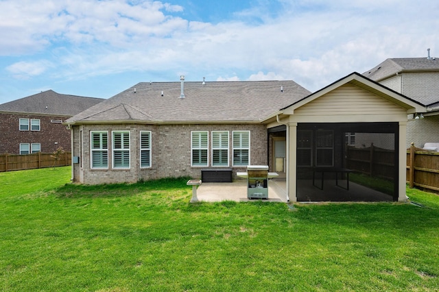 rear view of property with a patio, brick siding, a sunroom, and a shingled roof