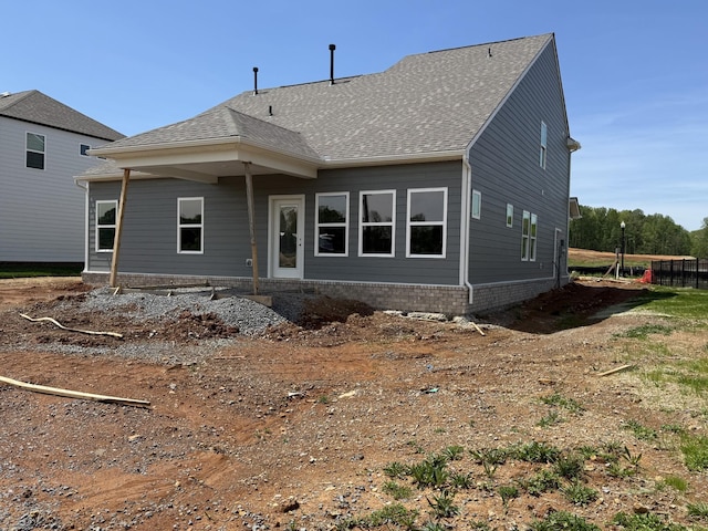 view of front of home featuring a shingled roof