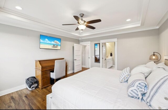 bedroom featuring a raised ceiling, recessed lighting, crown molding, baseboards, and wood finished floors