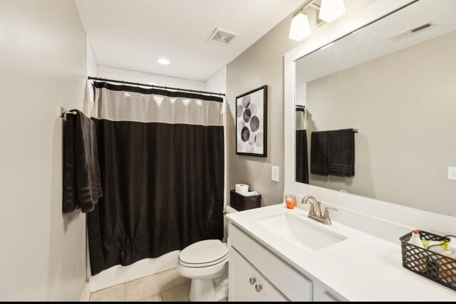 bathroom featuring toilet, vanity, curtained shower, tile patterned floors, and recessed lighting