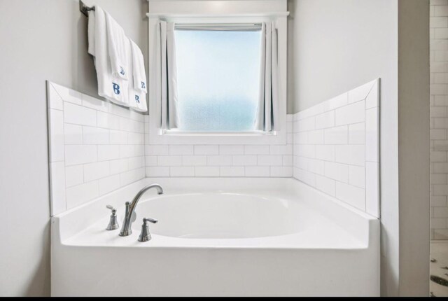 bathroom featuring a garden tub