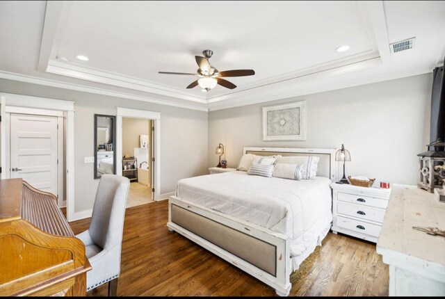 bedroom featuring a tray ceiling, ornamental molding, wood finished floors, recessed lighting, and ceiling fan