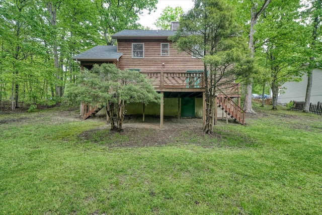 rear view of property with stairs, a wooden deck, a chimney, and roof with shingles