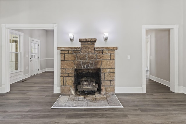 1405 W Lincoln St, Tullahoma, TN 37388 - living area featuring baseboards, wood finished floors, and a fireplace