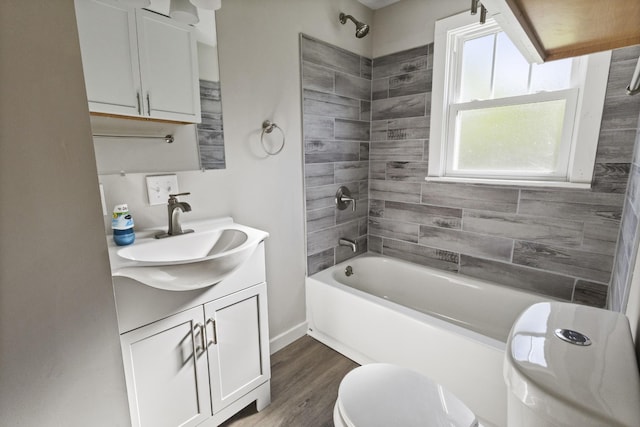 1405 W Lincoln St, Tullahoma, TN 37388 - full bath with vanity, wood finished floors, toilet, and shower / tub combination