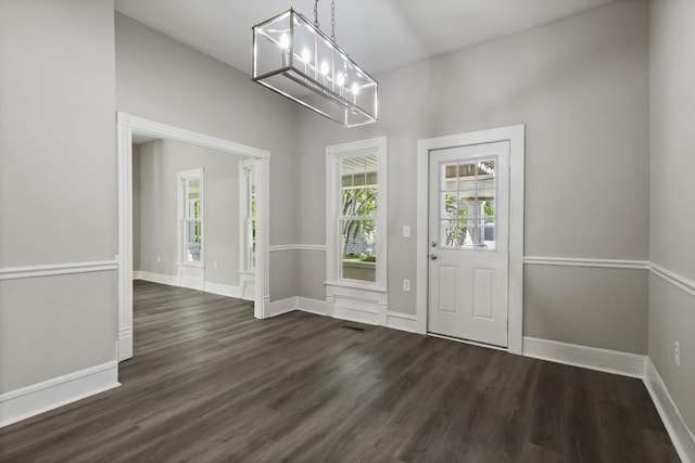 1405 W Lincoln St, Tullahoma, TN 37388 - entryway featuring dark wood-type flooring, baseboards, and a chandelier