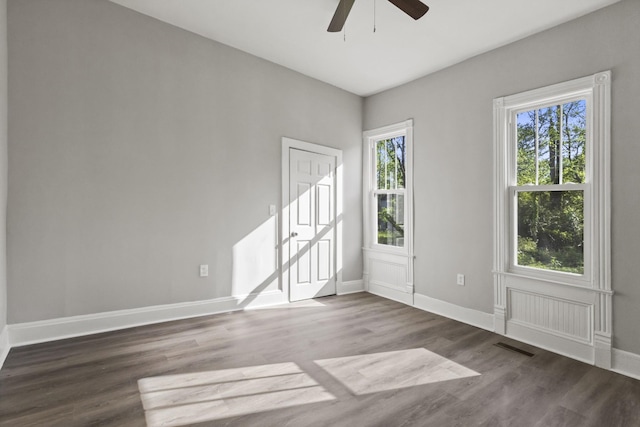 1405 W Lincoln St, Tullahoma, TN 37388 - unfurnished room with ceiling fan, plenty of natural light, wood finished floors, and baseboards