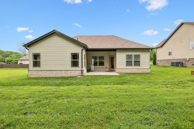 657 Josef Cir, Columbia, TN 38401 - rear view of property featuring a patio area, a lawn, central AC, and brick siding