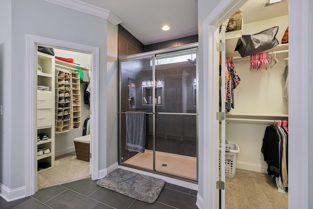 657 Josef Cir, Columbia, TN 38401 - full bath featuring a spacious closet, a stall shower, baseboards, tile patterned floors, and ornamental molding