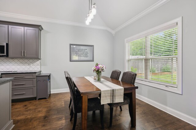 657 Josef Cir, Columbia, TN 38401 - dining area with lofted ceiling, crown molding, dark wood-style flooring, and baseboards