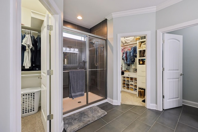 657 Josef Cir, Columbia, TN 38401 - full bathroom featuring a spacious closet, a stall shower, tile patterned flooring, crown molding, and baseboards