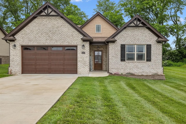 657 Josef Cir, Columbia, TN 38401 - view of front facade with an attached garage, driveway, brick siding, and a front lawn