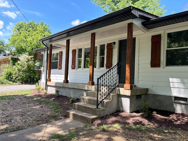 entrance to property with covered porch