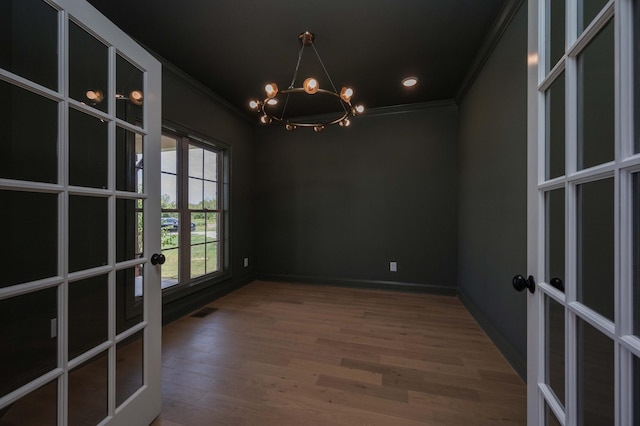 0 Pat Nixon Ct, Murfreesboro, TN 37130 - spare room with french doors, ornamental molding, a chandelier, wood finished floors, and baseboards