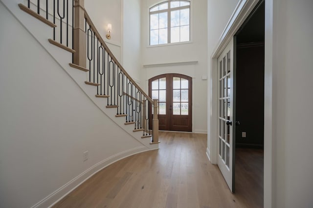0 Pat Nixon Ct, Murfreesboro, TN 37130 - entrance foyer featuring french doors, wood finished floors, stairs, a towering ceiling, and baseboards