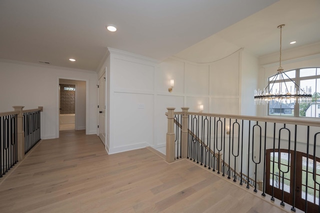 0 Pat Nixon Ct, Murfreesboro, TN 37130 - corridor with a chandelier, an upstairs landing, a decorative wall, wood finished floors, and crown molding