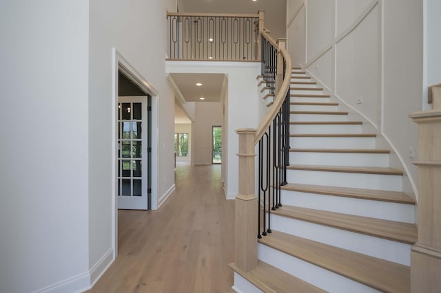 0 Pat Nixon Ct, Murfreesboro, TN 37130 - staircase with wood finished floors, a towering ceiling, recessed lighting, and baseboards
