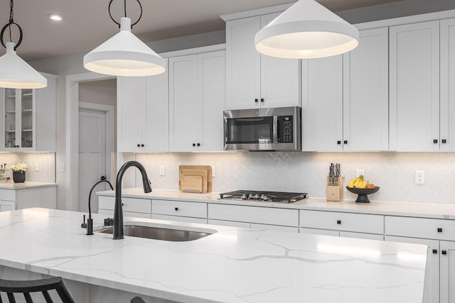 9016 Nestling Ridge Ct, College Grove, TN 37046 - kitchen featuring stainless steel appliances, a sink, white cabinetry, and recessed lighting