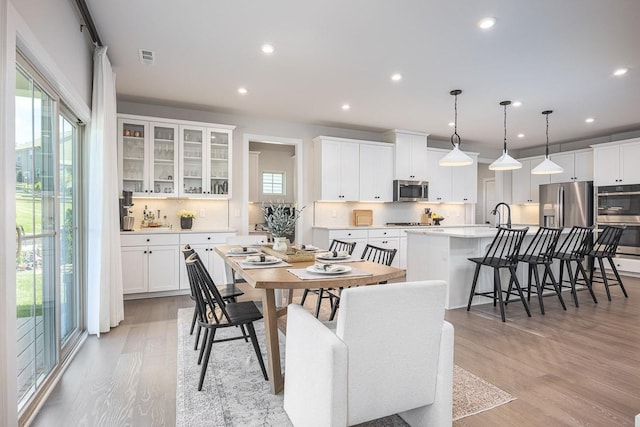 9016 Nestling Ridge Ct, College Grove, TN 37046 - dining area featuring light wood-type flooring and recessed lighting