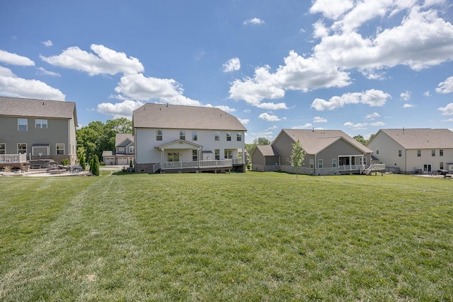 9016 Nestling Ridge Ct, College Grove, TN 37046 - back of property with a residential view, a lawn, and a deck